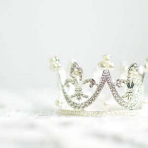 shallow photography of silver-colored crown