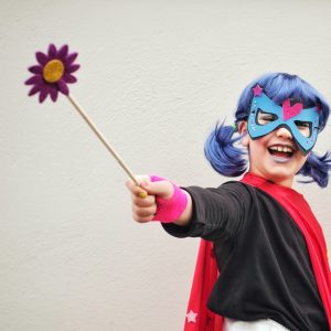 woman in black and red long sleeve shirt with blue and purple hair