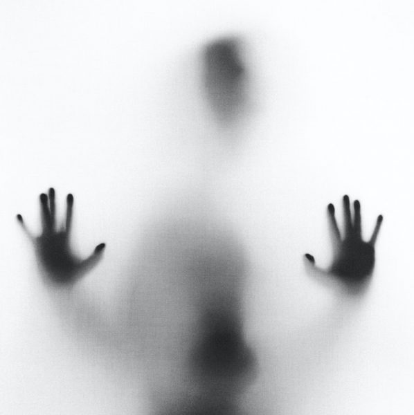 person behind fog glass