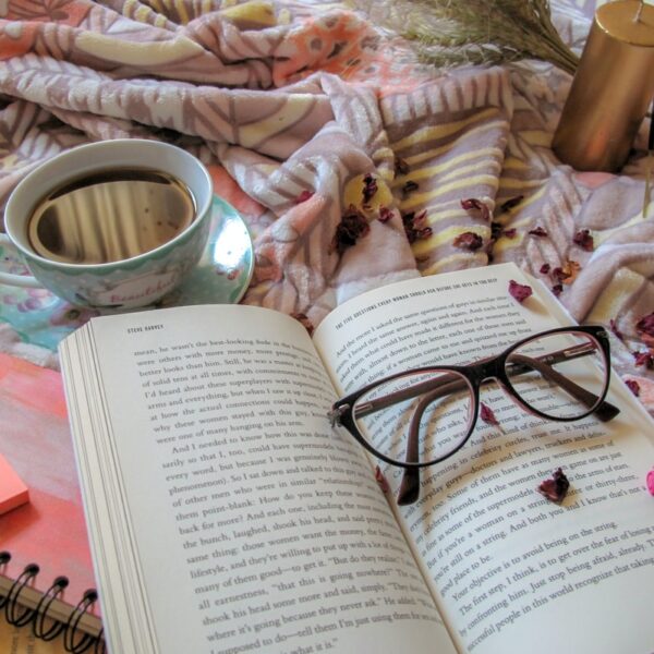 black framed eyeglasses on book page