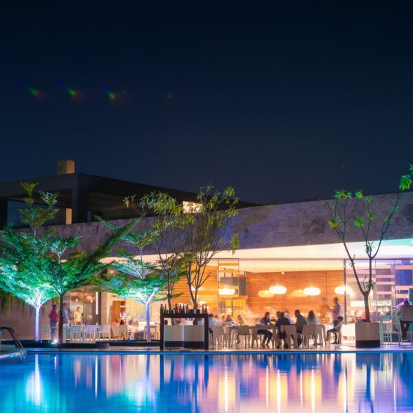 white concrete building near river