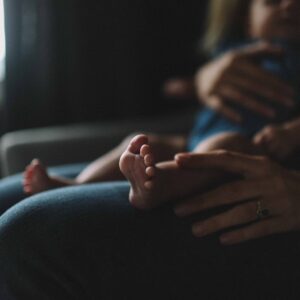 person carrying baby on lap