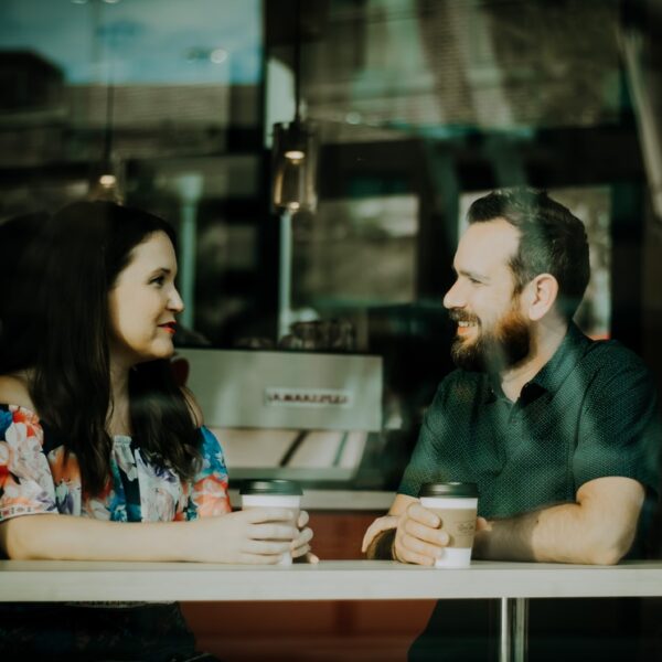 couple drinking coffee inside coffee shop