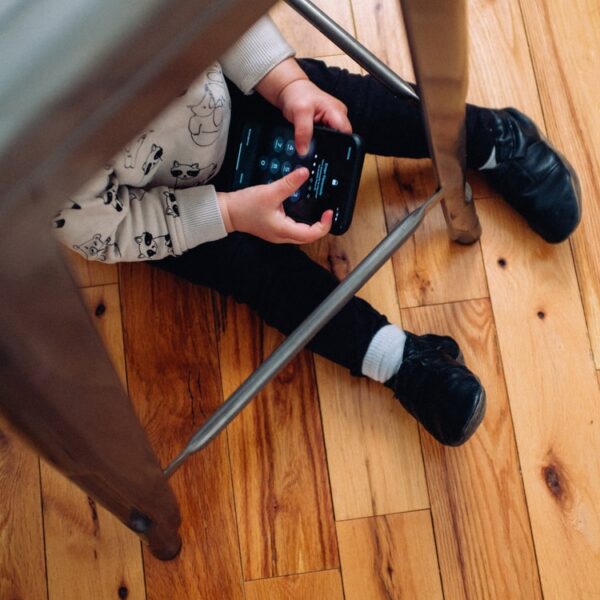 person in gray pants and black socks