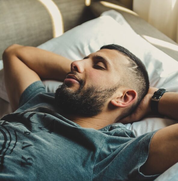 man lying on bed