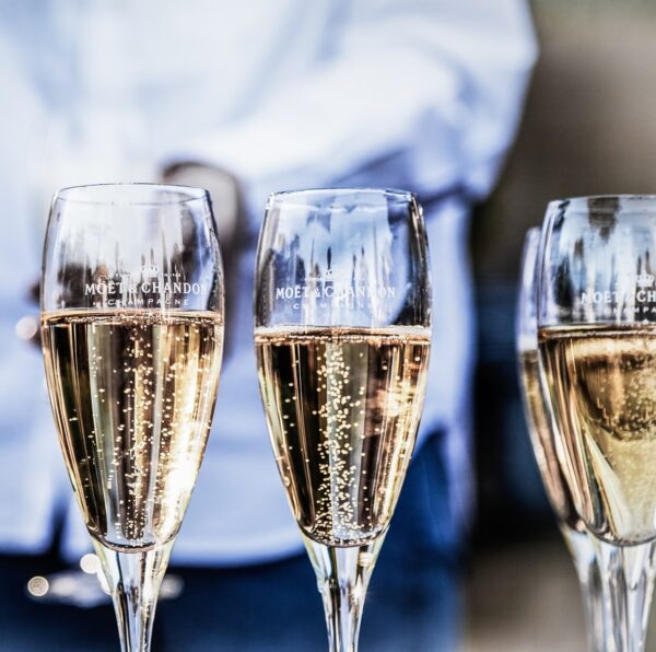 four clear champagne flutes