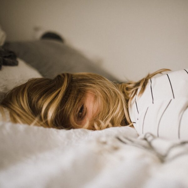 woman lying on bed