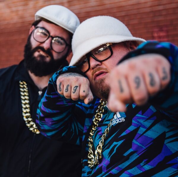 man in blue and yellow striped long sleeve shirt wearing white cap