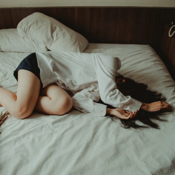 woman lying on bed