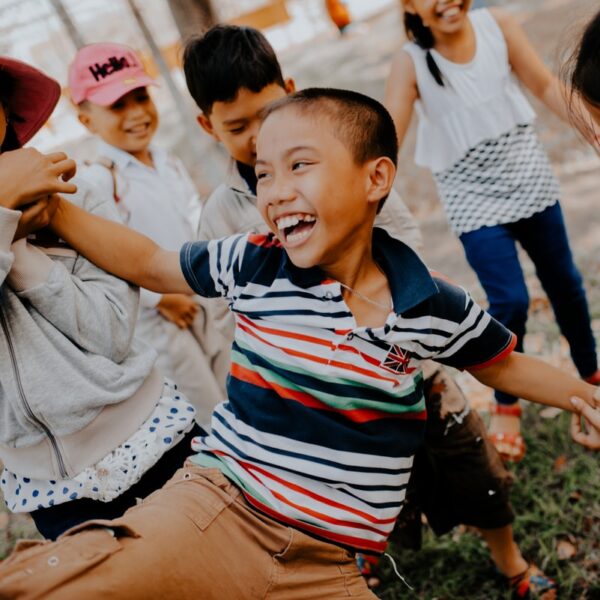children playing on grass field