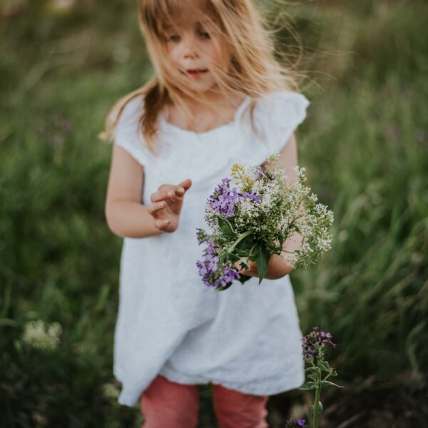 girl holding bouquet of flowers
