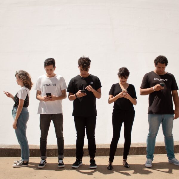 group of people standing on brown floor