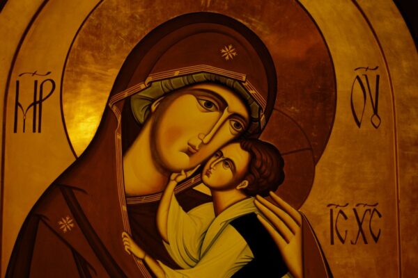 woman in black dress painting