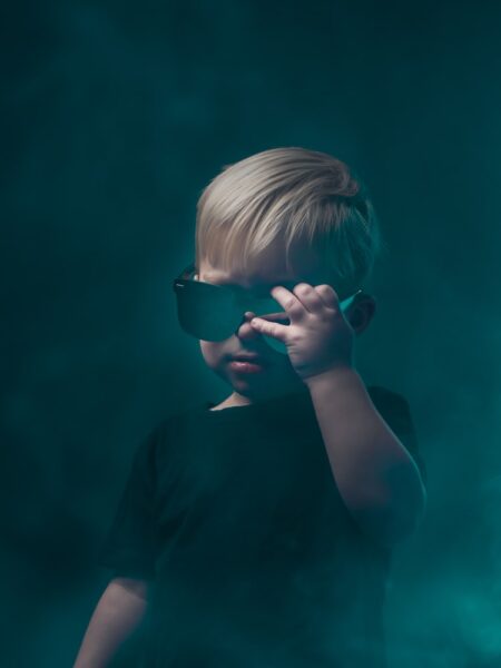 girl in black shirt wearing black sunglasses